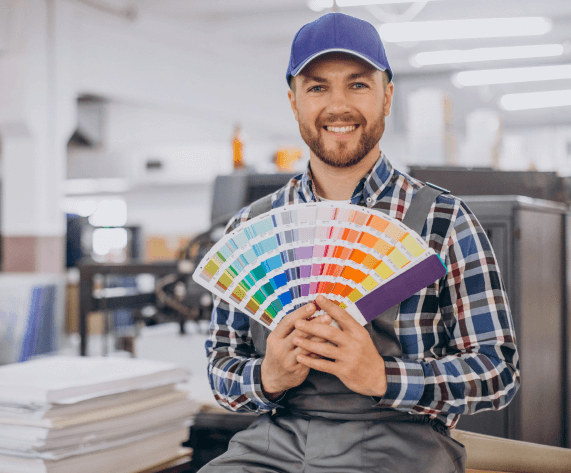 man working printing house with paper paints 1